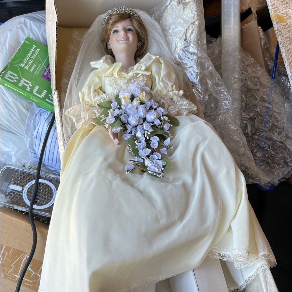 Vintage elegant porcelain Bride Doll with Cream Dress and Floral Bouquet